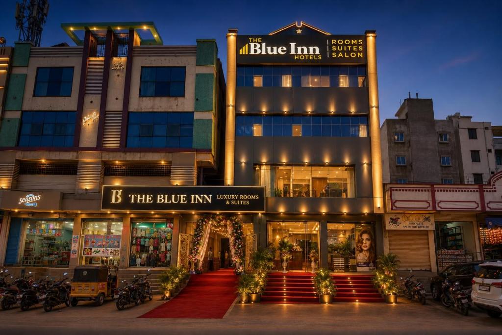 a building with a sign that reads b the blue inn at The Blue Inn Hotel in Hyderabad