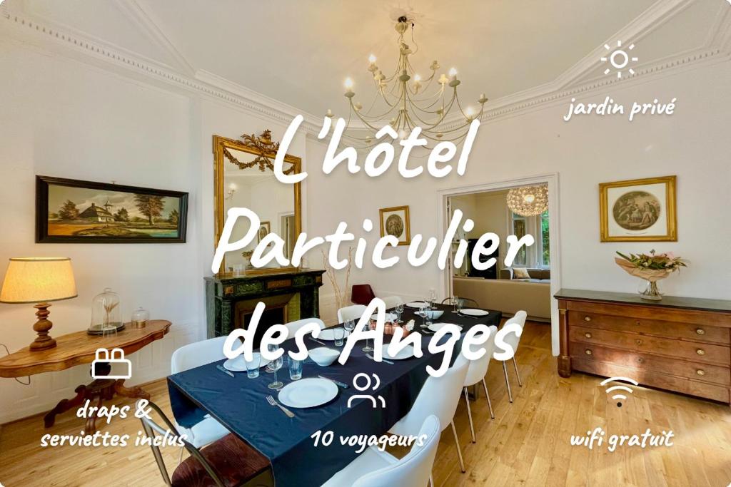 a dining room with a table and a chandelier at L’Hôtel Particulier des Anges in Reims