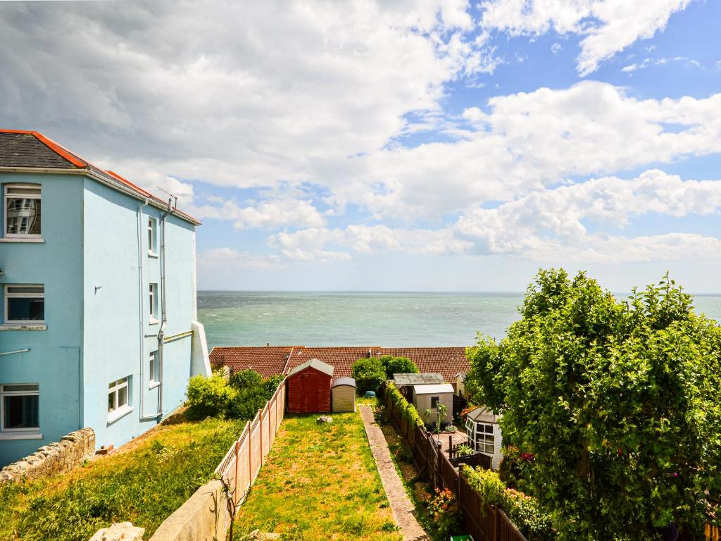 a view of the ocean from a house at Jan Dee Cottage in Ventnor