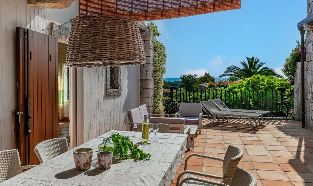 a table and chairs on a patio at Li Conchi 44 in Castiadas