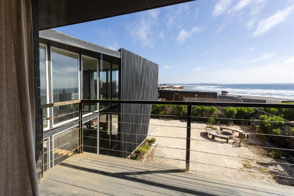 a view of the ocean from the balcony of a house at Casas Punta Costanera in Pichilemu