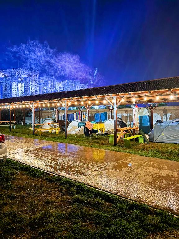 a group of tents in a building with lights at Relax by the Sea Camping next to Nibiru in Costinesti