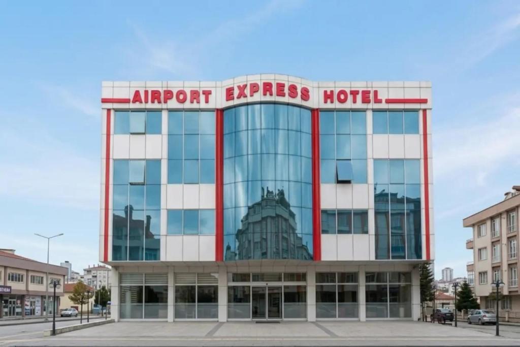 a building with a sign on top of it at Istanbul Airport Express Hotel in Arnavutköy