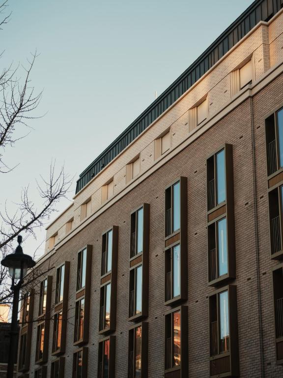 a brick building with a street light in front of it at The Shepherd Mayfair in London