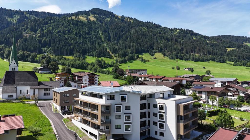 an aerial view of a town with a mountain at Mountain Inn - Hochquartier - Wildschönau in Niederau