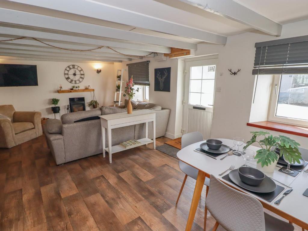 a living room with a couch and a table at 41 St James Street in Narberth