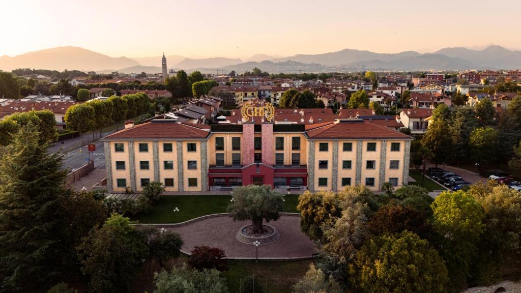 an aerial view of a building with a clock tower at Grand Hotel del Parco in Stezzano