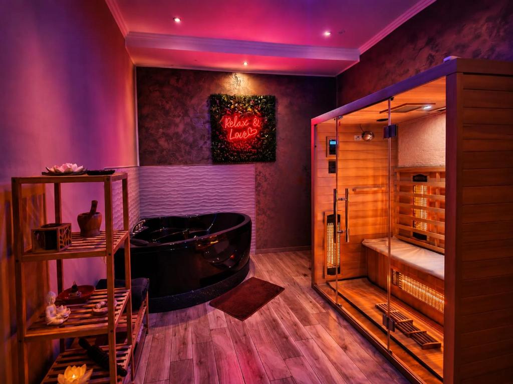 a room with a bar with a tub in it at Suite Natura Bed&Beauty Spa in Taranto