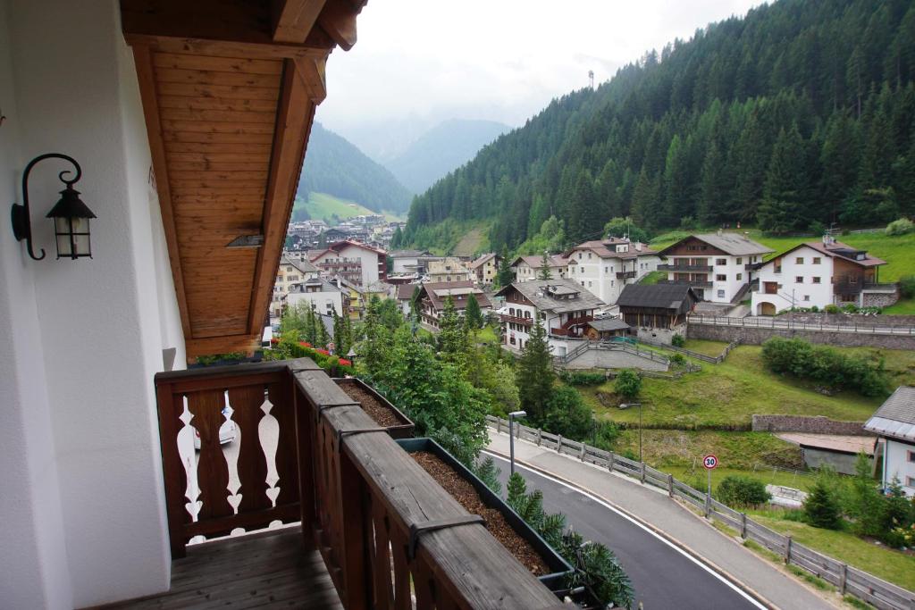 a balcony of a house with a view of a mountain at Apartments Rusctlea in Selva di Val Gardena