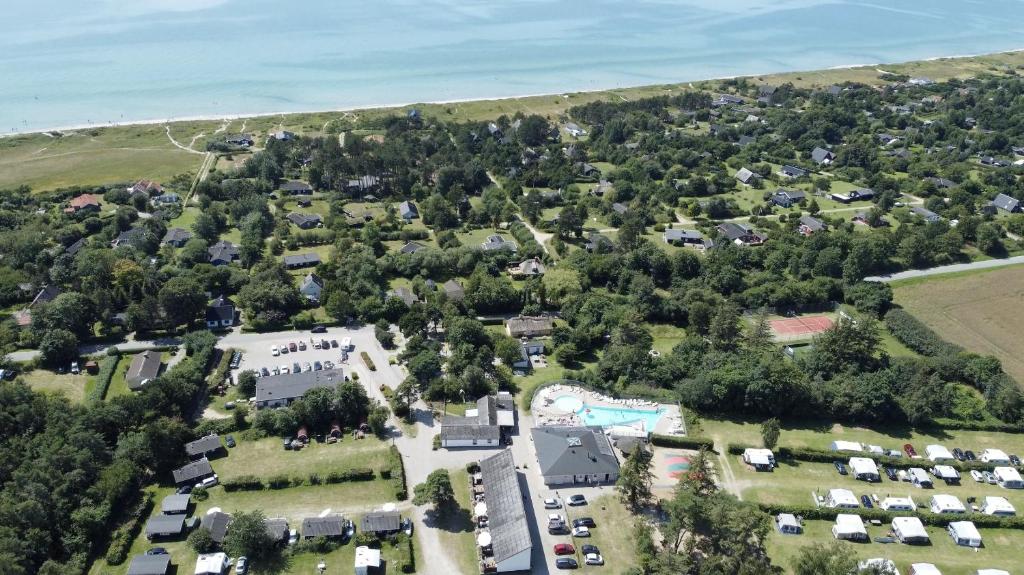 an aerial view of a house with trees and the ocean at Feriepark Langeland Ristinge (Feriepark Langeland) in Humble