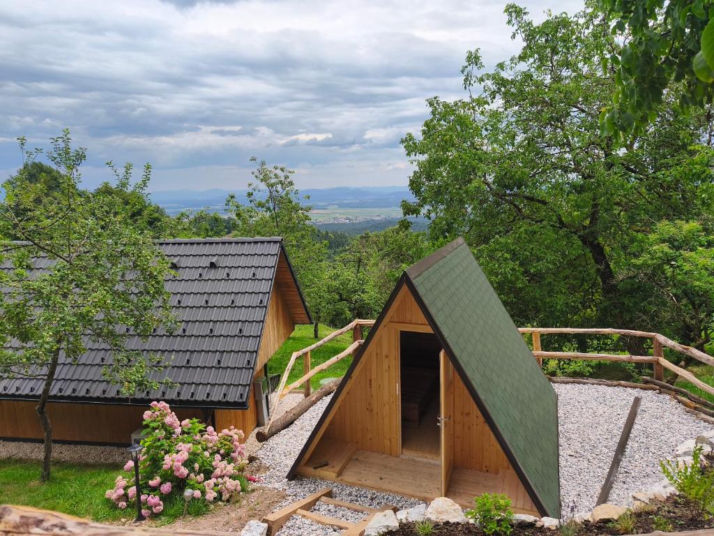 a small wooden building with a roof at Pr' Končovc - wooden tent in Kranj