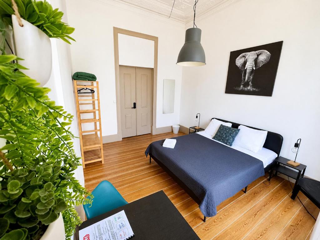 a bedroom with a bed in a room at Ambiente Hostel in Lisbon