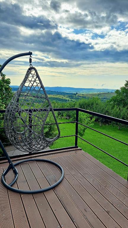 a basket sitting on top of a wooden deck at Casa 3 Catei Veseli in Seciu