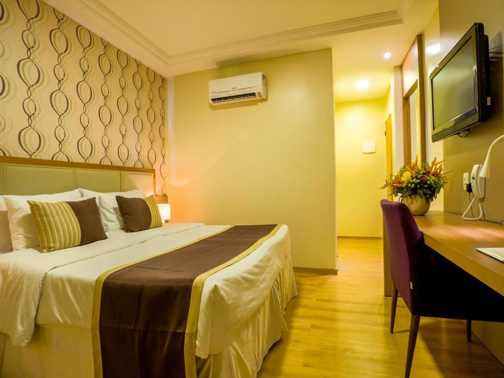 Cama o camas de una habitación en Argentina Hotel