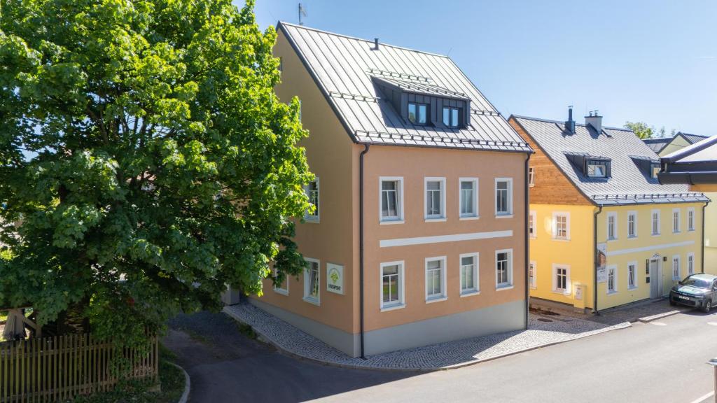 an overhead view of a building with yellow at KRUSHPOINT Krušnohorský hotel in Horní Blatná