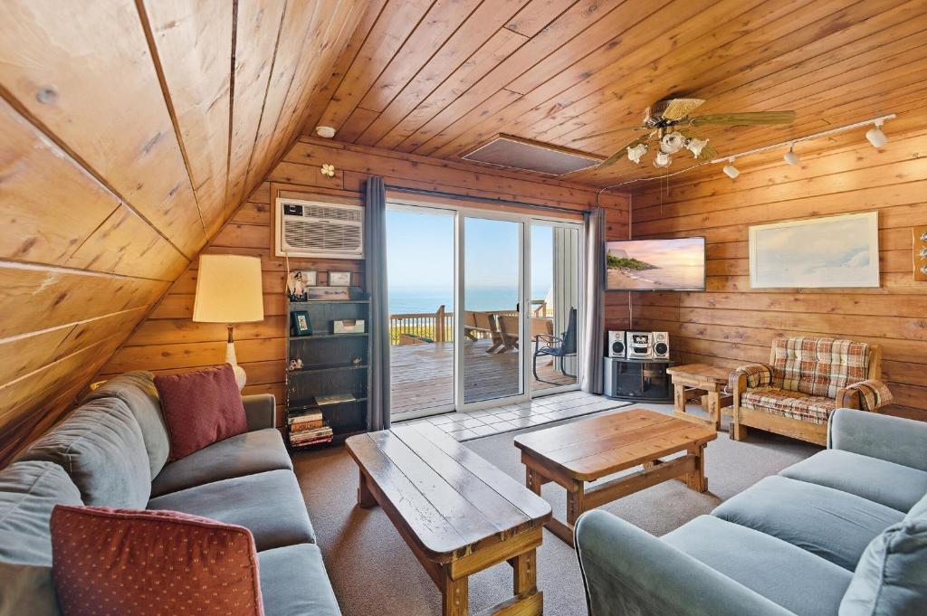 a living room with a couch and a table at Chalet #17 in Stevensville