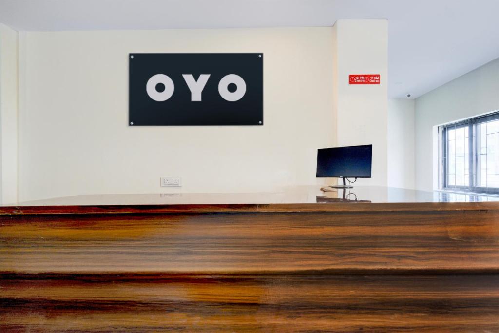 an empty room with a sign on the wall at Hotel O RB STAY in Haidar Sāhibgūda