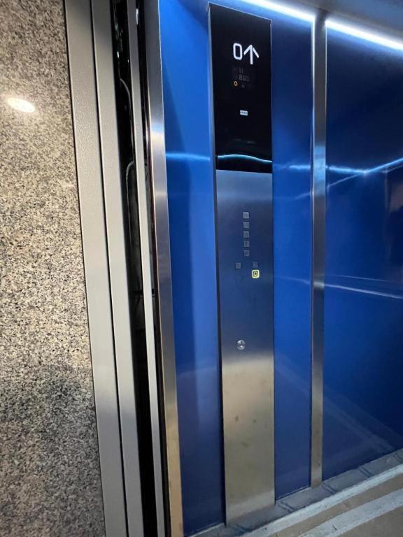 a close up of a blue and black microwave oven at Nova Stay in Rome
