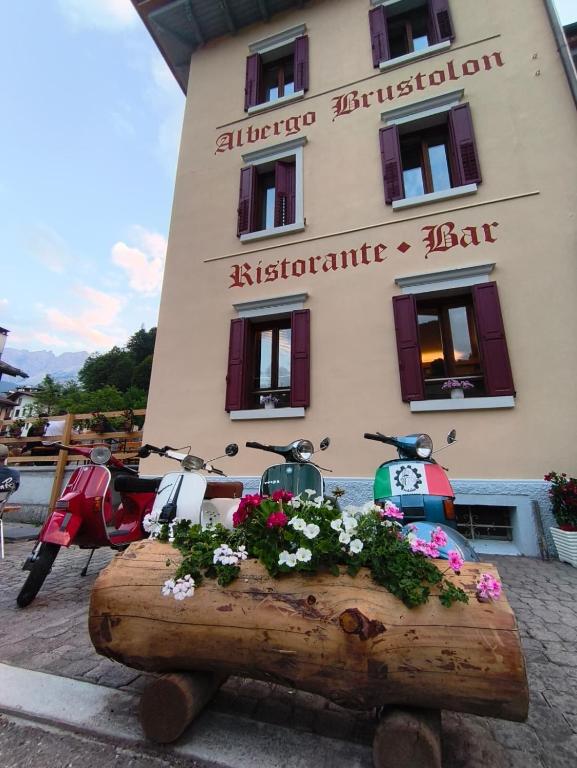 a building with a planter in front of a building at Albergo Brustolon in Dont