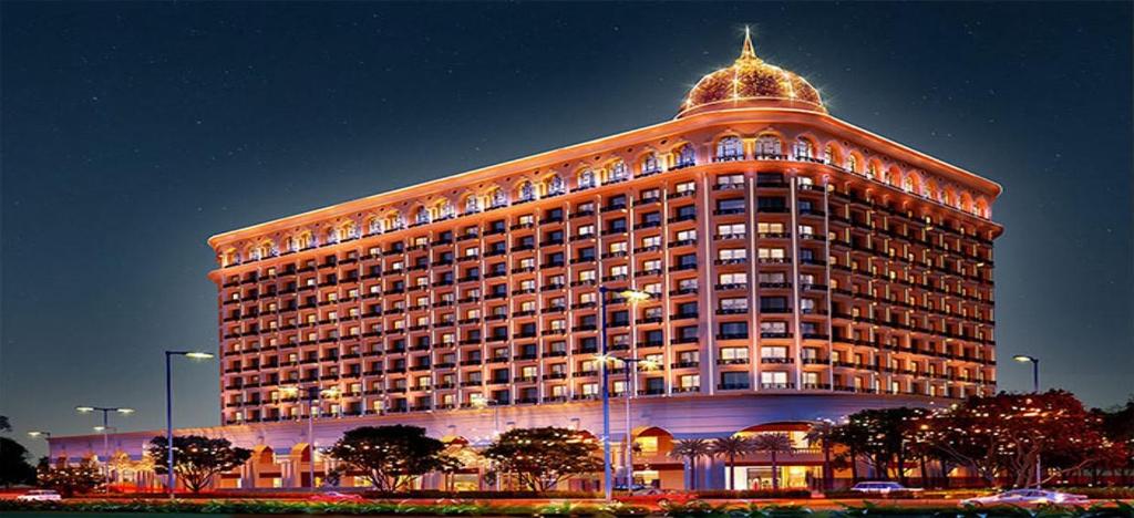 a large building with a dome on top of it at Omaxe Hazratganj Stay in Lucknow