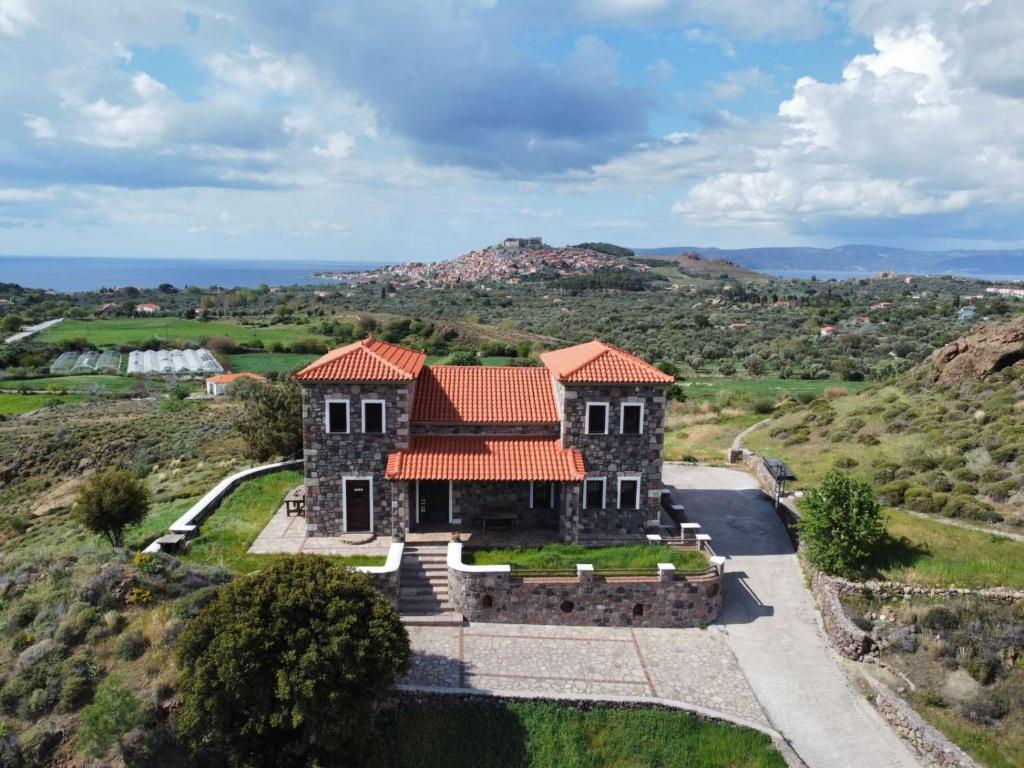 an aerial view of a house with a mountain at Molivos Castleview Luxury Villa with private parking in Mythimna