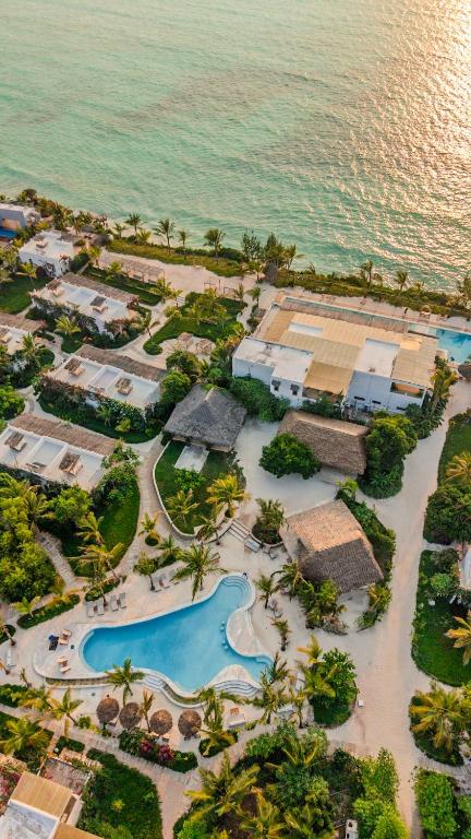an aerial view of a resort next to the ocean at Kaskazi Hotel Zanzibar in Jambiani