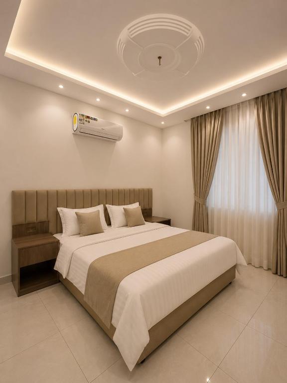 a bedroom with a large bed in a room at Comfort Stay 3 in Taif