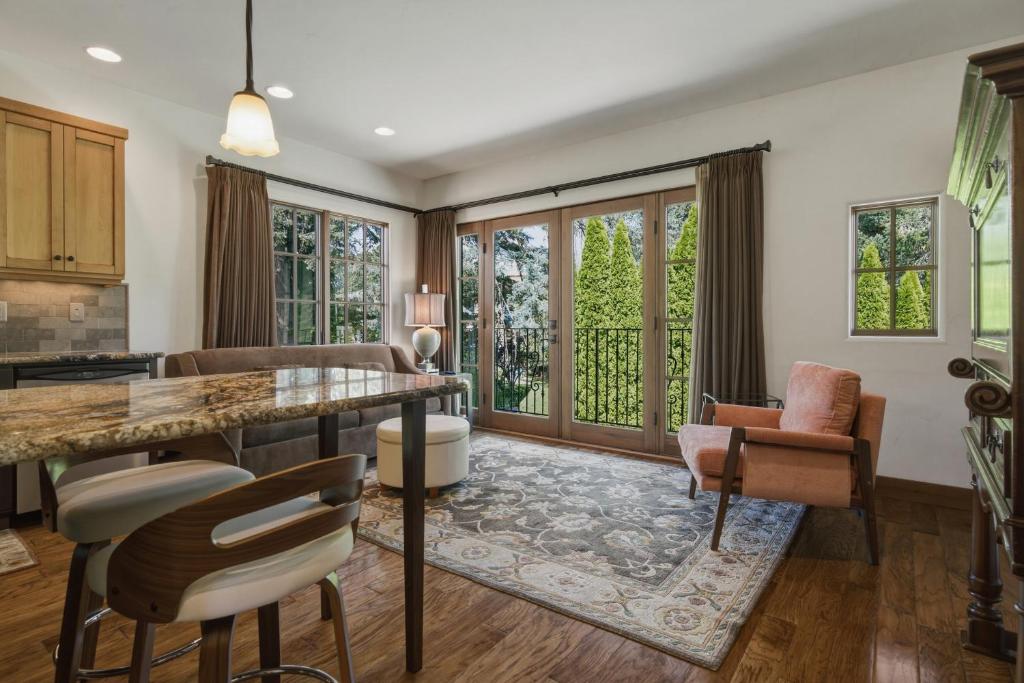 a kitchen and living room with a table and chairs at Columbia Cliff Villas in Hood River