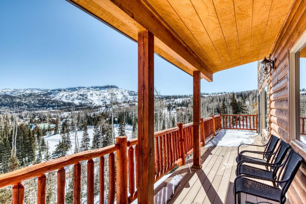a deck with two chairs and a view of the mountains at Brian Head 'View-Topia' w/ Mtn Views & King Suite in Brian Head