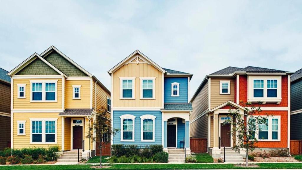 a row of colorful houses in a row at Havenly Homes DMV in Arlington
