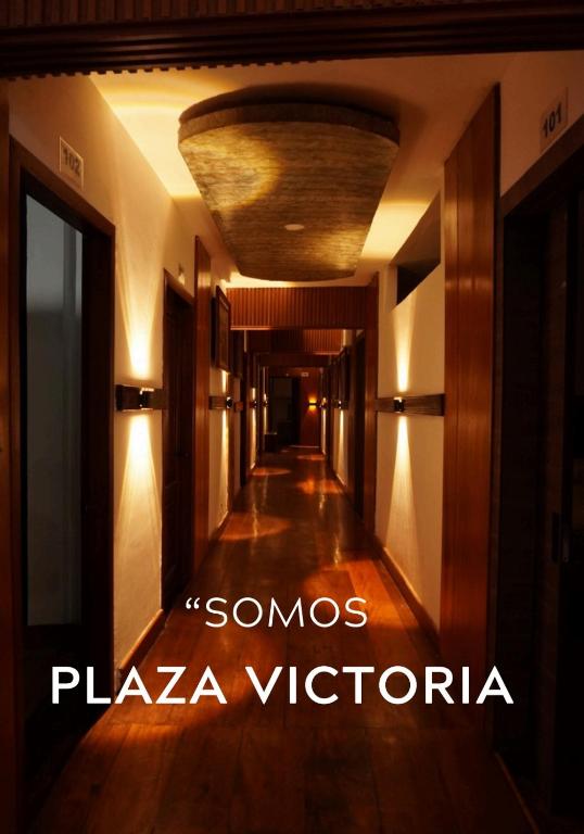 a hallway in a building with a ceiling at Hotel Cristian in Puyo