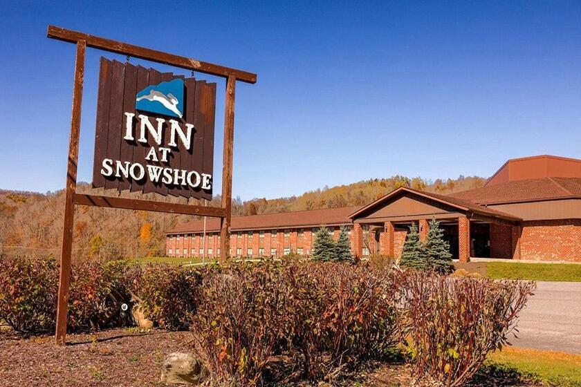 a sign for a inn at snoqualmieemeteryemetery at Inn at Snowshoe in Snowshoe
