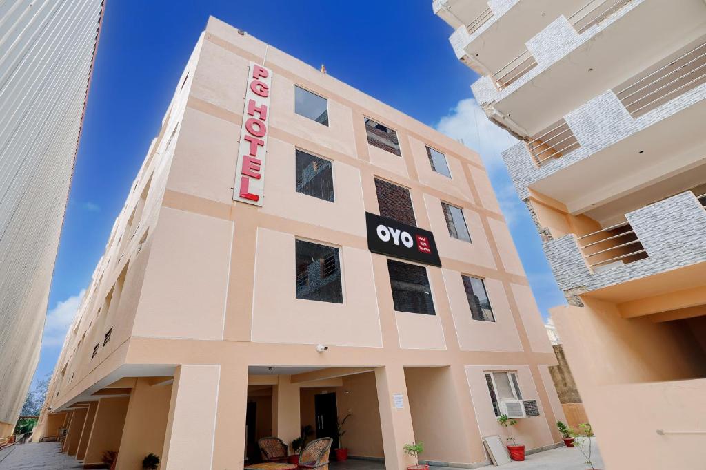 a building with a sign on the side of it at Hotel O M3M Paradise in Bhiwadi