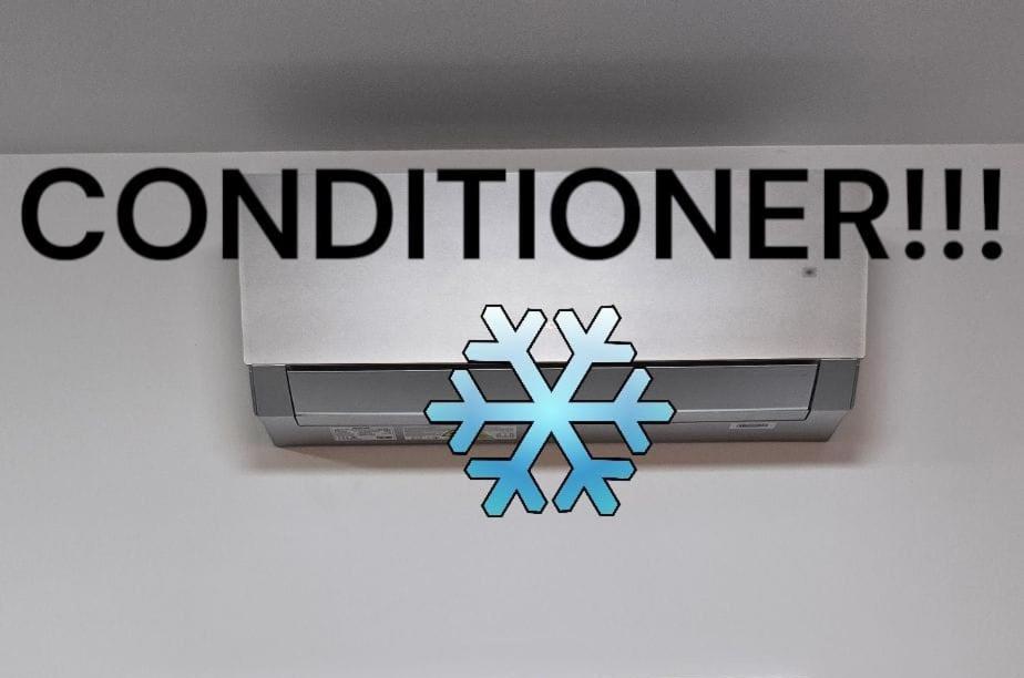 a sign for a car dealership with a snowflake at Barona apartement in Jelgava