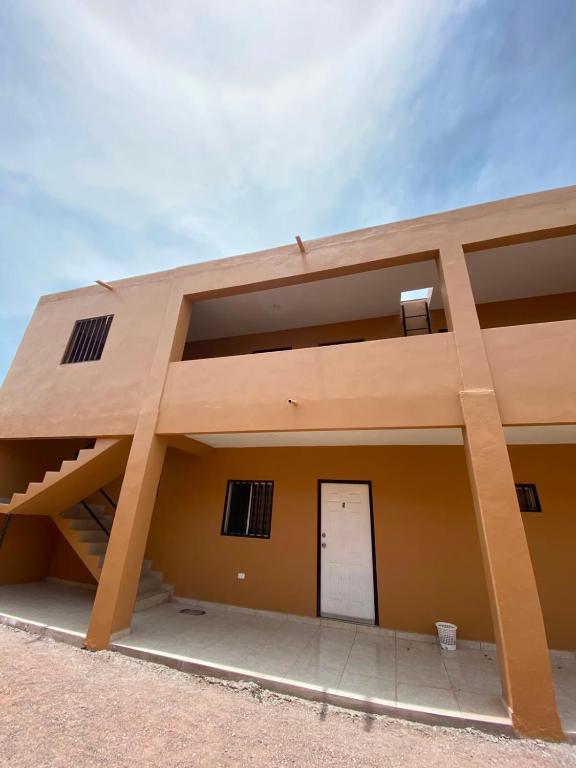 a large building with a white door on it at Departamento #3 in San Carlos