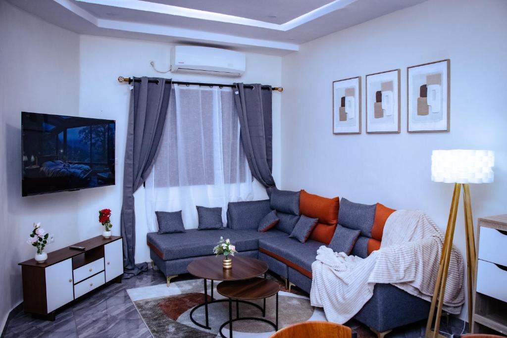 a living room with a couch and a table at La Cas'a Yehud in Aoudja