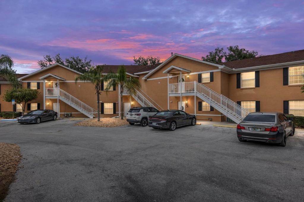 a apartment building with cars parked in a parking lot at Condominium at Lakeside Golf & CC - unit 104 apts in Inverness