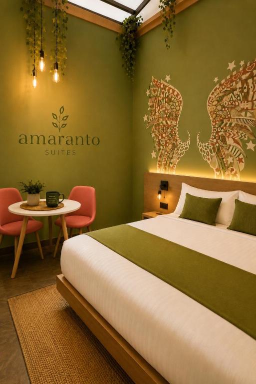 a hotel room with a bed and a table at Amaranto Suites in Medellín