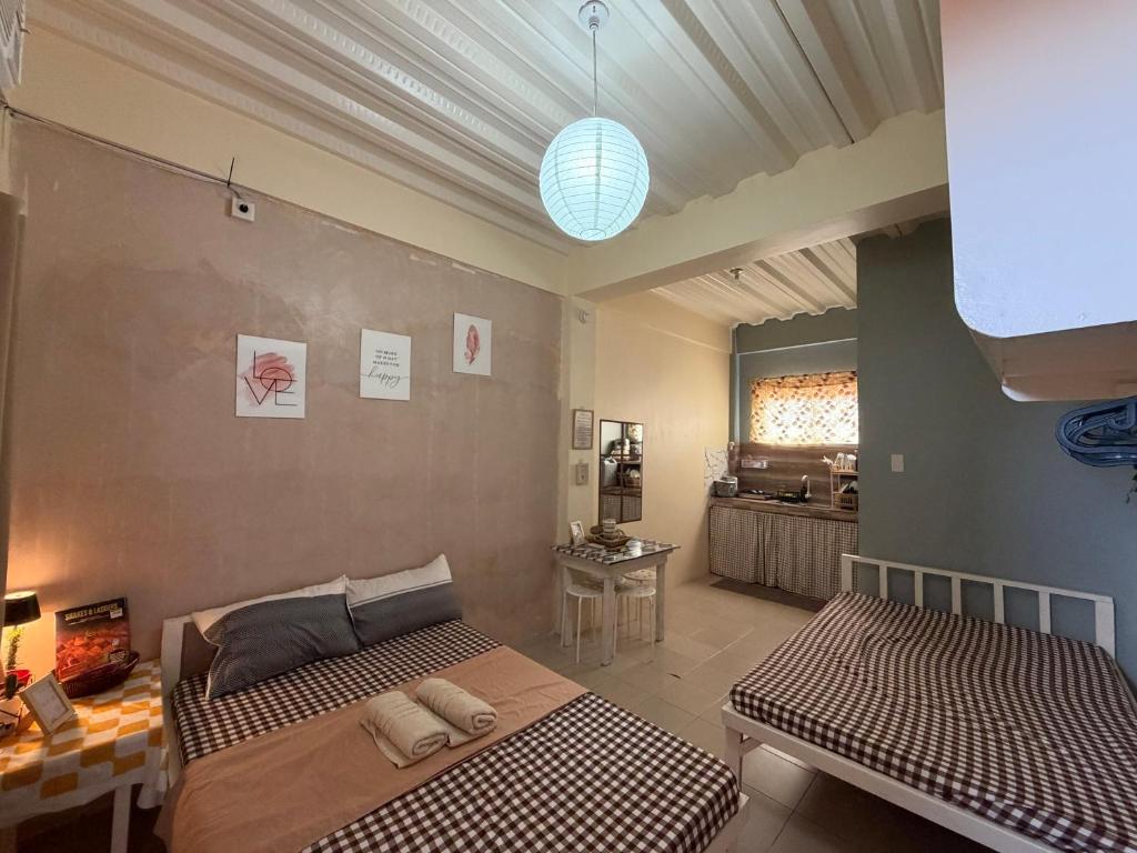 a bedroom with two beds in a room at Maru Vibe Studio unit in San Juan