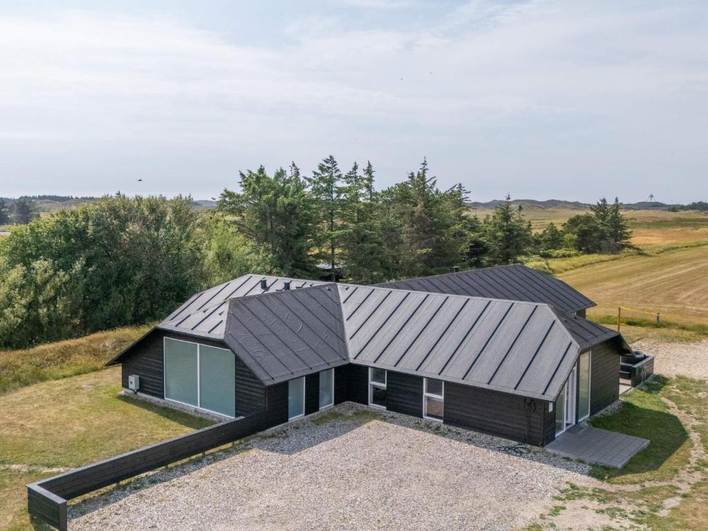 an aerial view of a house with a metal roof at Luxury Retreat in Vorupor in Snedsted