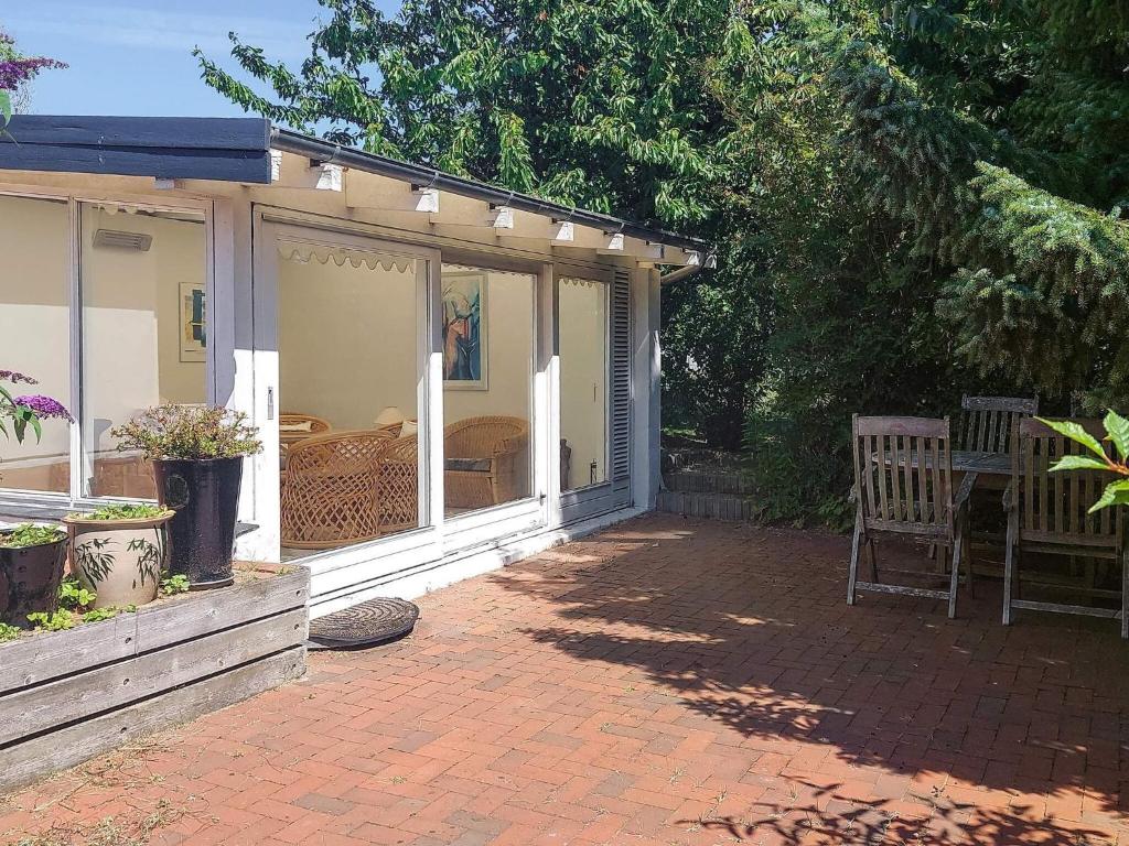 a screened in porch of a house at 4 star holiday home in Hundested in Hundested