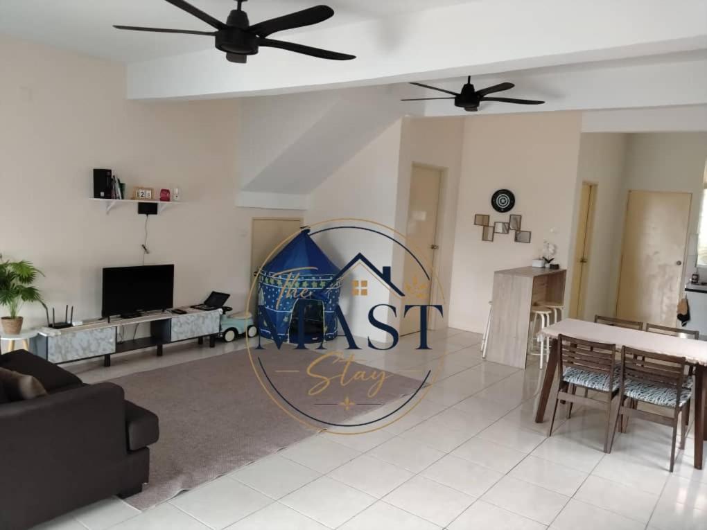 a living room with a house sign on the wall at The MAST Stay "for islam people only" in Tampin