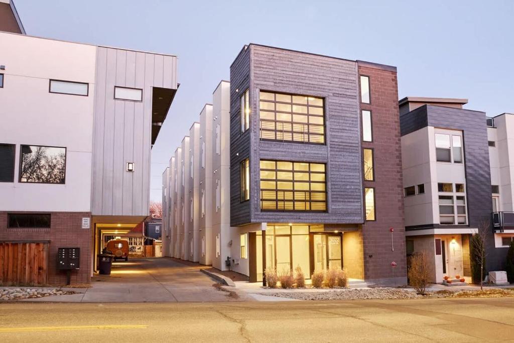 a group of buildings on a city street at Roami at Zuni in Denver
