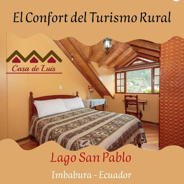 a bedroom with a bed in a room at Casa de Luis in Otavalo