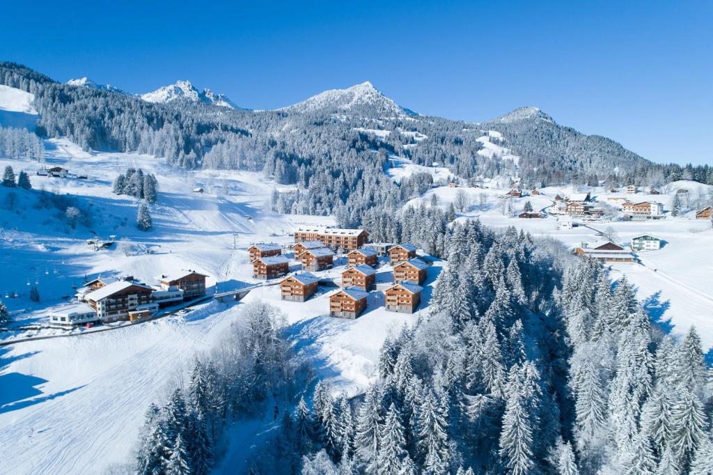 an aerial view of a resort in the snow at Landal Brandnertal in Bürserberg