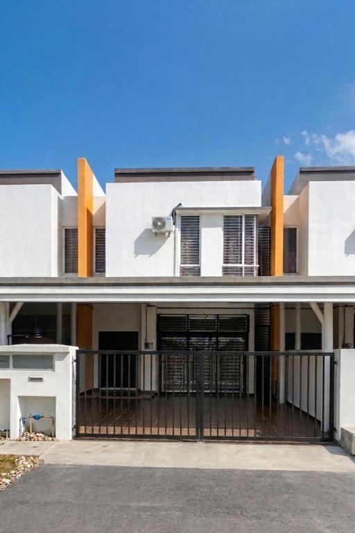 a large white house with a black gate at Eden Vista in Kuantan