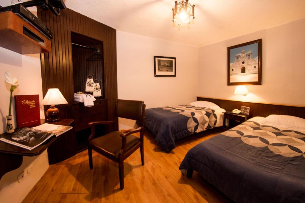 Postel nebo postele na pokoji v ubytování Hotel Montecarlo