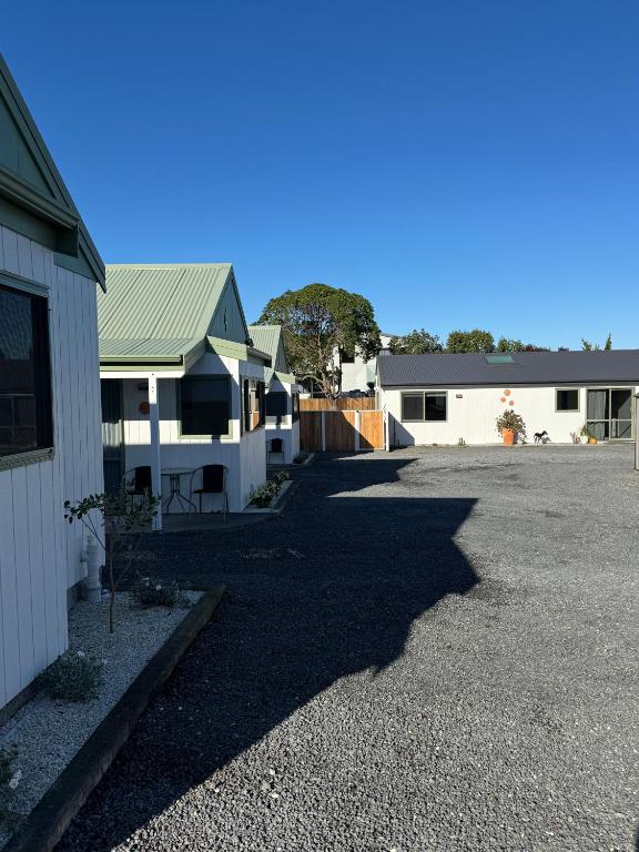 a row of houses in a parking lot at Bay Cottages in Kaikoura