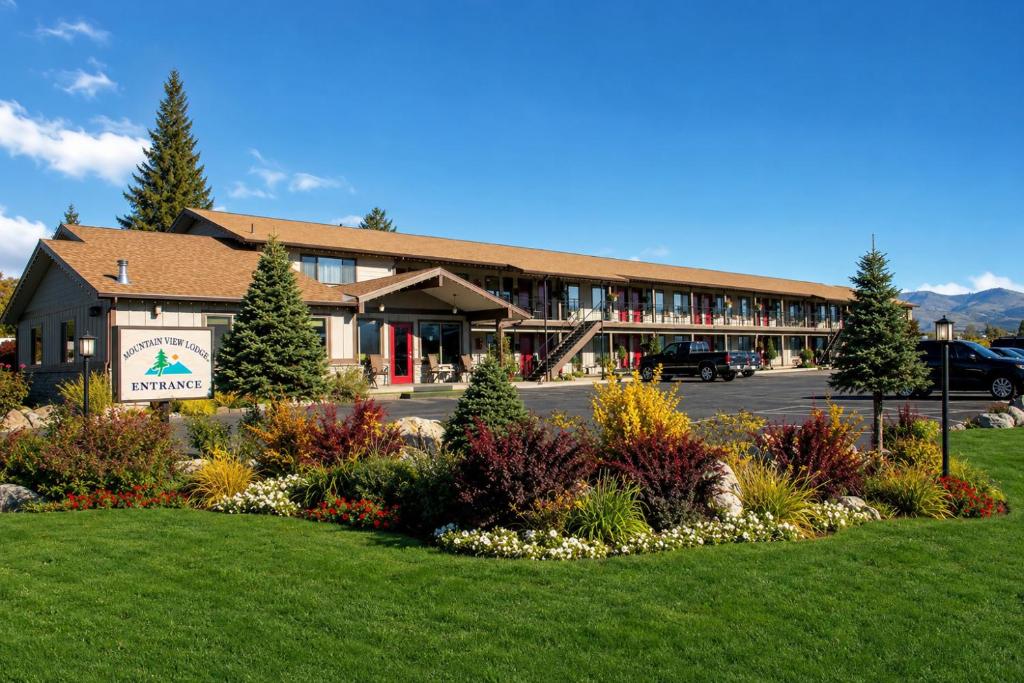 a resort building with a lawn in front of it at Mountain View Lodge in Chelan