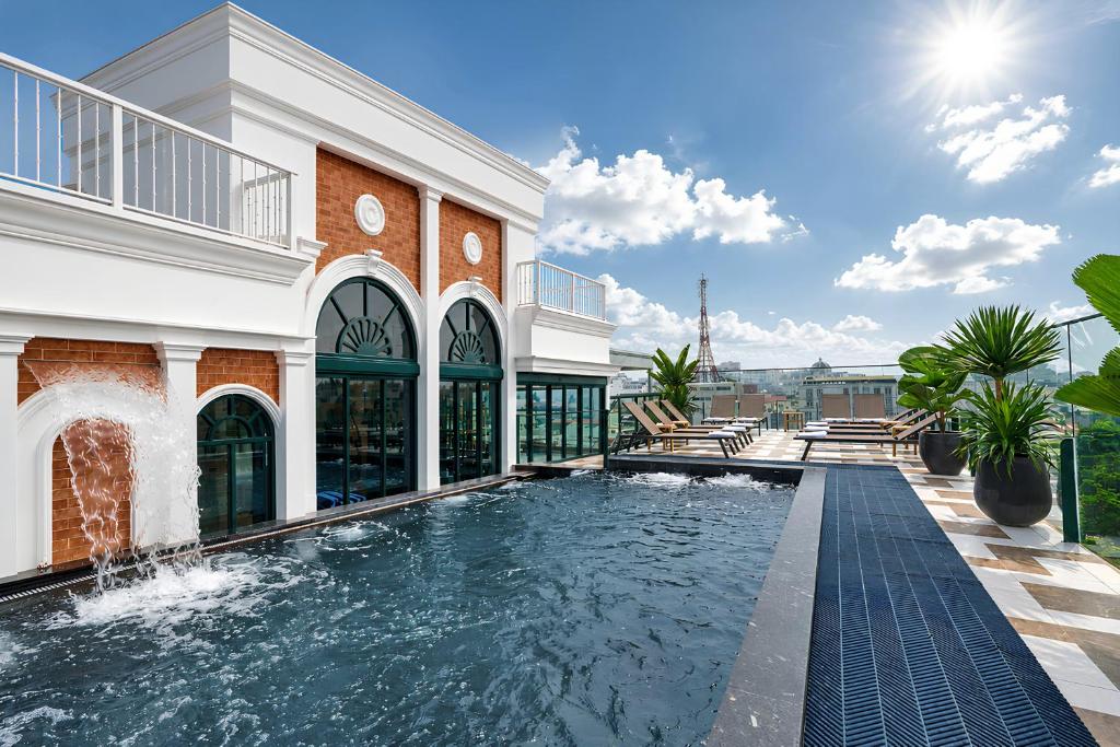a swimming pool on the side of a building at Solaria d'Oriente Hotel in Hanoi
